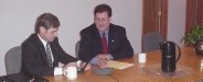 Teleconference at the GAVX conference room table.
